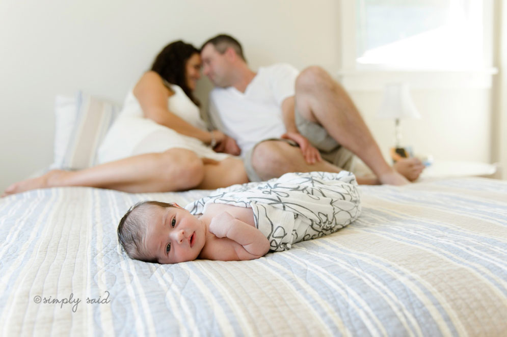 11-baby-on-bed-newborn-photography-parents-cuddling